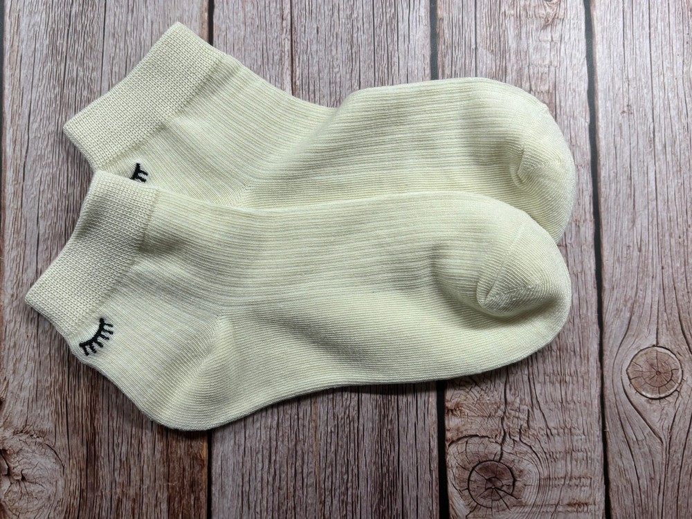 Socks with embroidered lashes