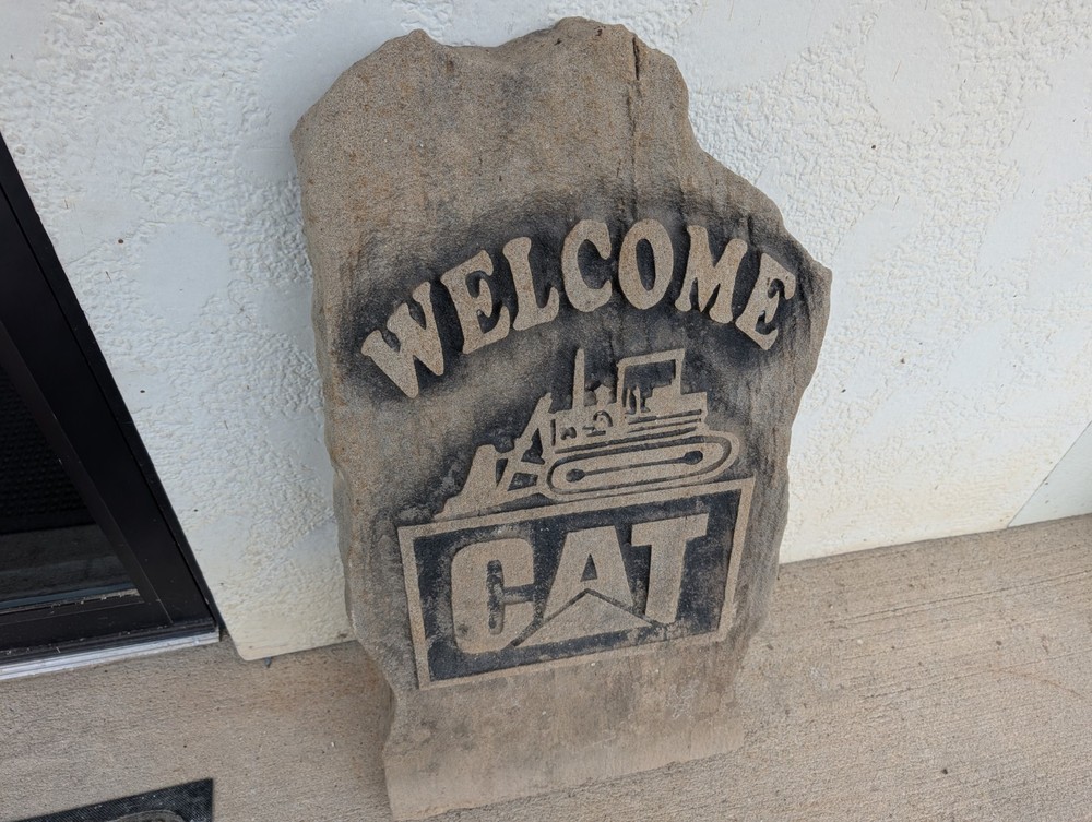 Concrete Caterpillar Welcome Sign