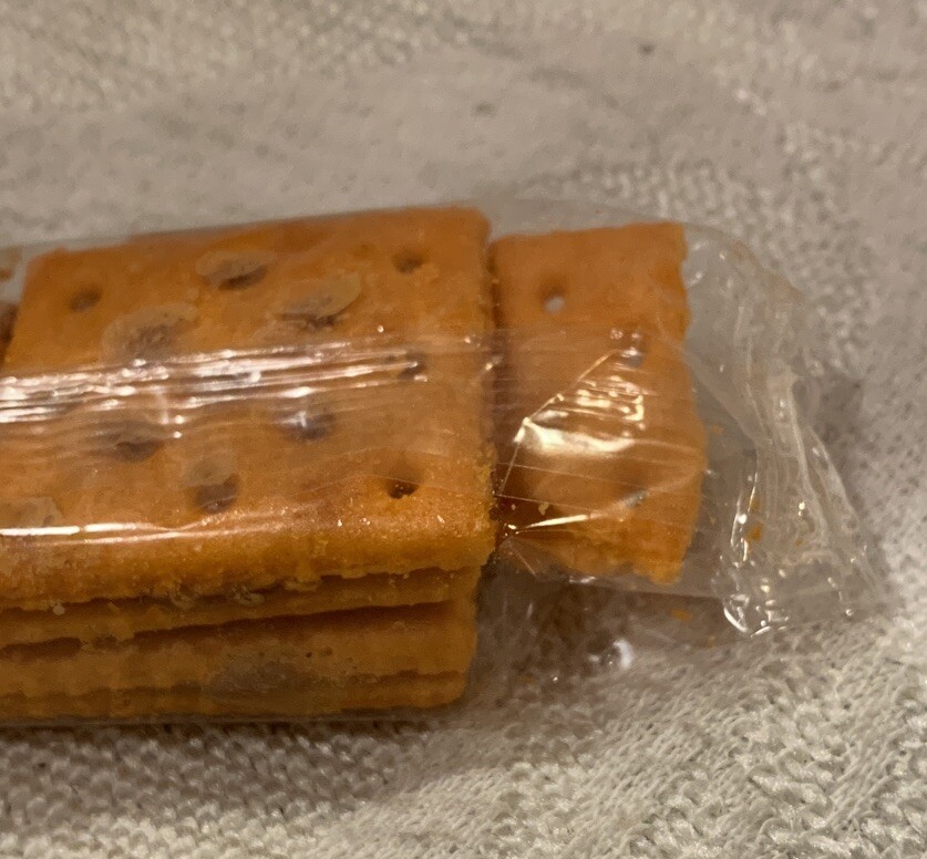 Manufacturing Error Four Pack Of Crackers With Extra Part Of Cracker In Pack