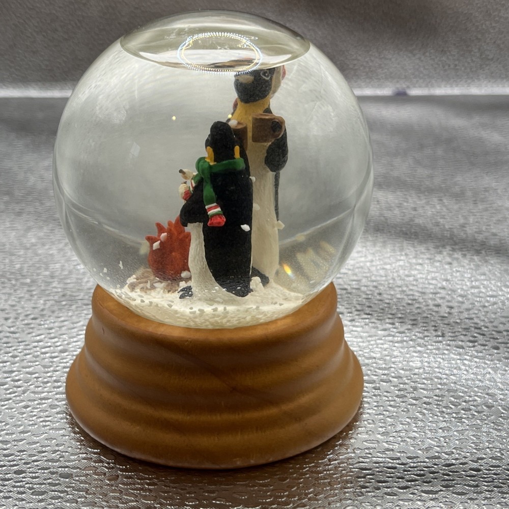 Eddie Bauer Penguin Snow globe 2002 Open Fire Roasting Marshmallows