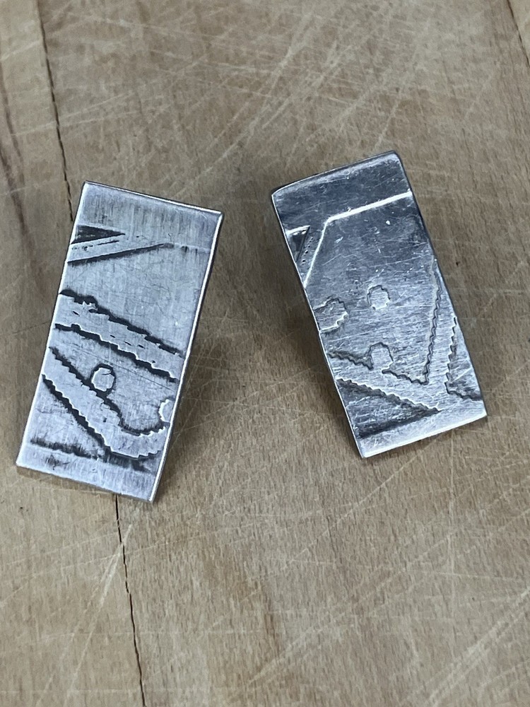 Handcrafted  sterling silver studs featuring oxidized Southwestern Style Native