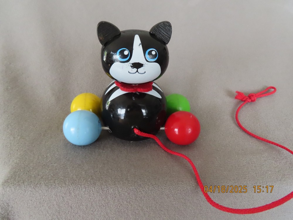 PULL TOY WOODEN BLACK & WHITE CAT WITH COLORED WHEELS - UNBRANDED