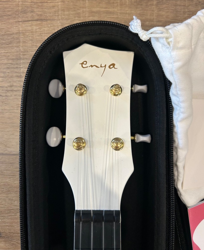 Enya Ukulele White, never used, tuner, extra strings, strap, case, very nice