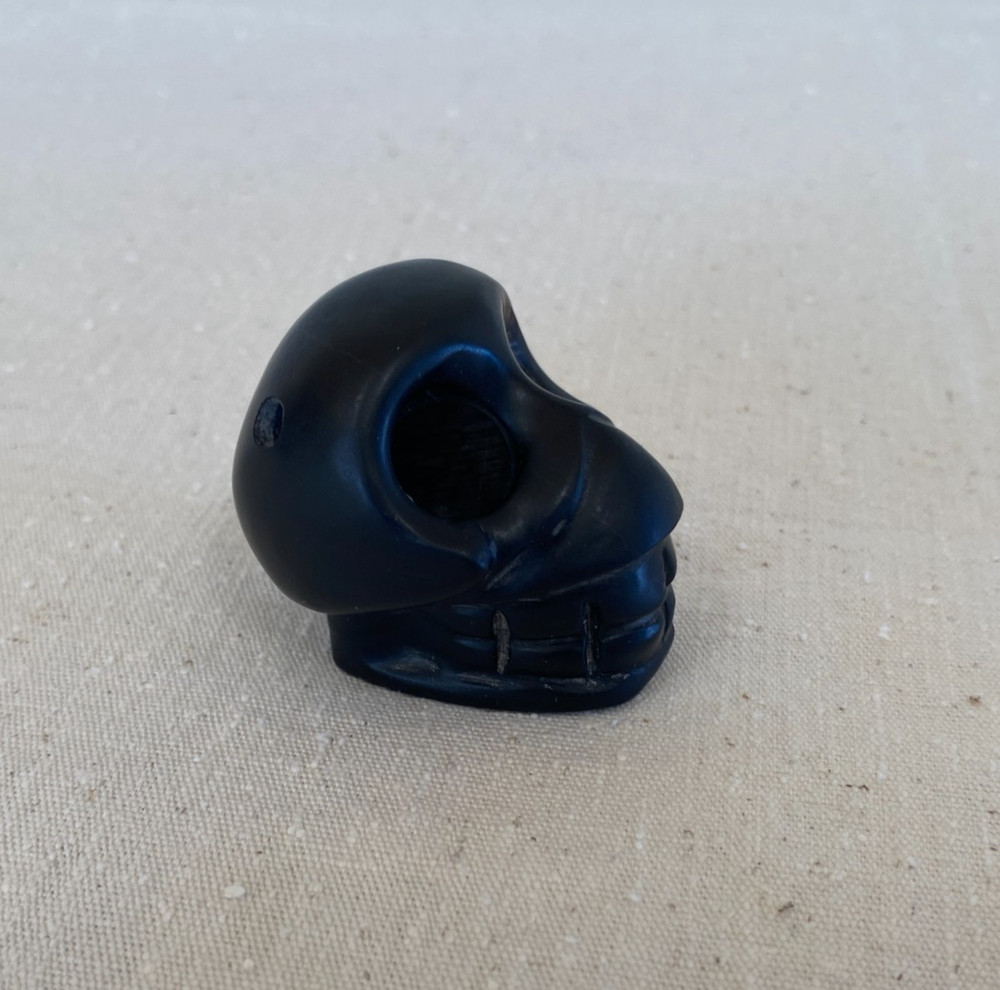 Stylized Carved Stone Skull Pendant