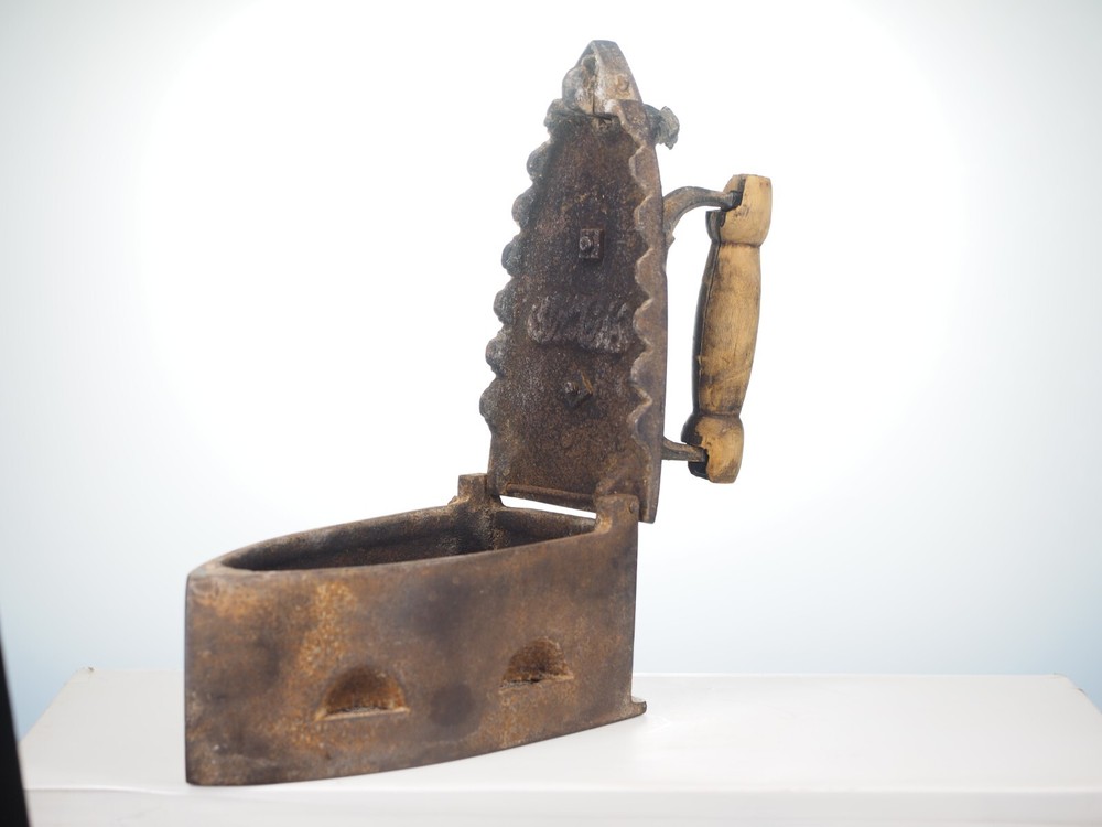 Antique cast iron coal fired clothing iron
