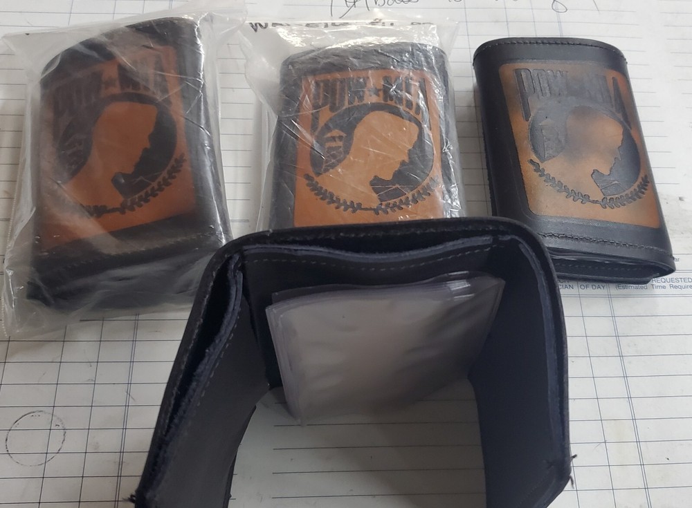 TRI FOLD LEATHER WALLET w/POW*MIA emossed on it