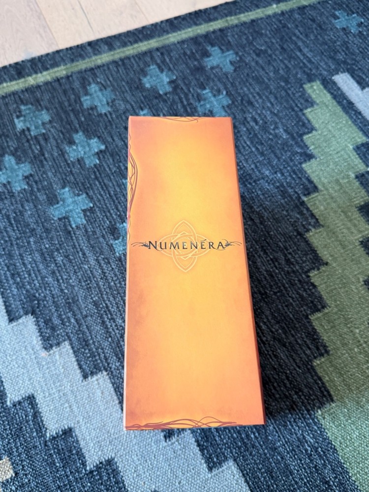 Numenera Reliquary Boxed Set (Kickstarter) and Q-Workshop Dice Sets