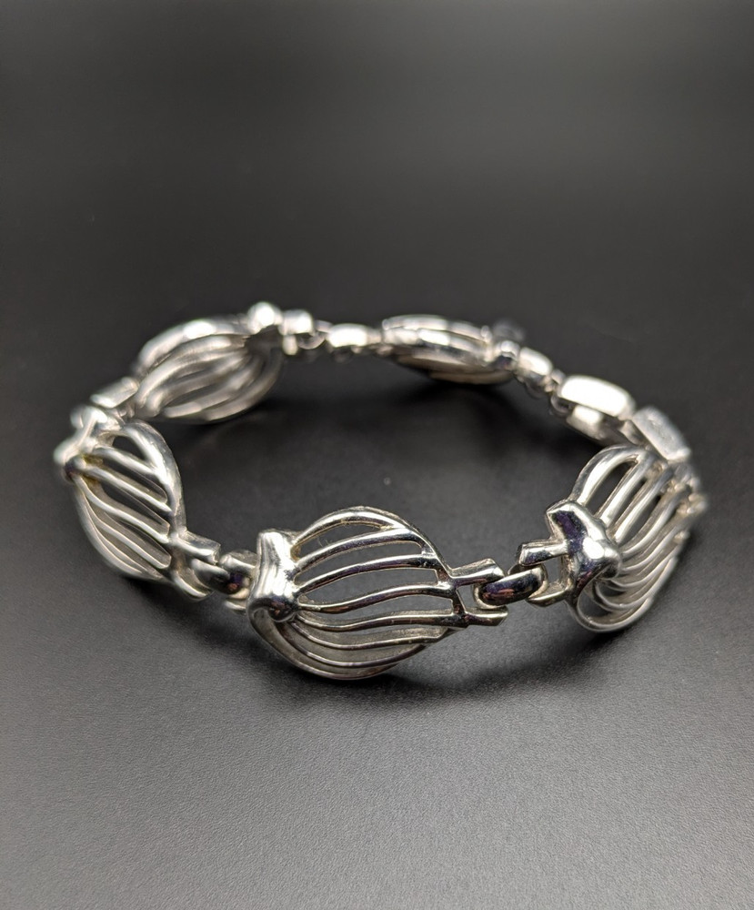 Silver-Toned Bracelet and Necklace Set Featuring Abstract Leaf Patterns