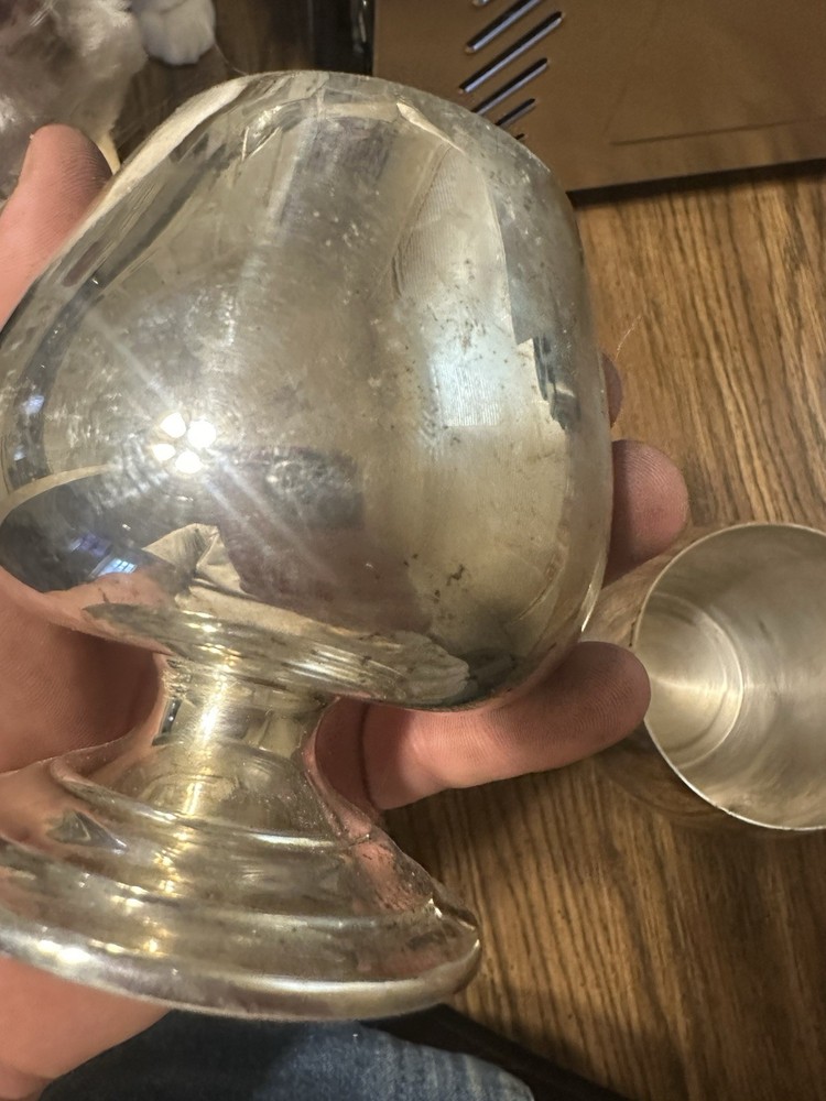 Set Of Four Silver Plated Cups.