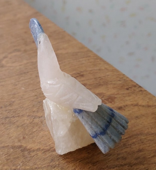Carved Stone's Tucan on a Quartz Crystal