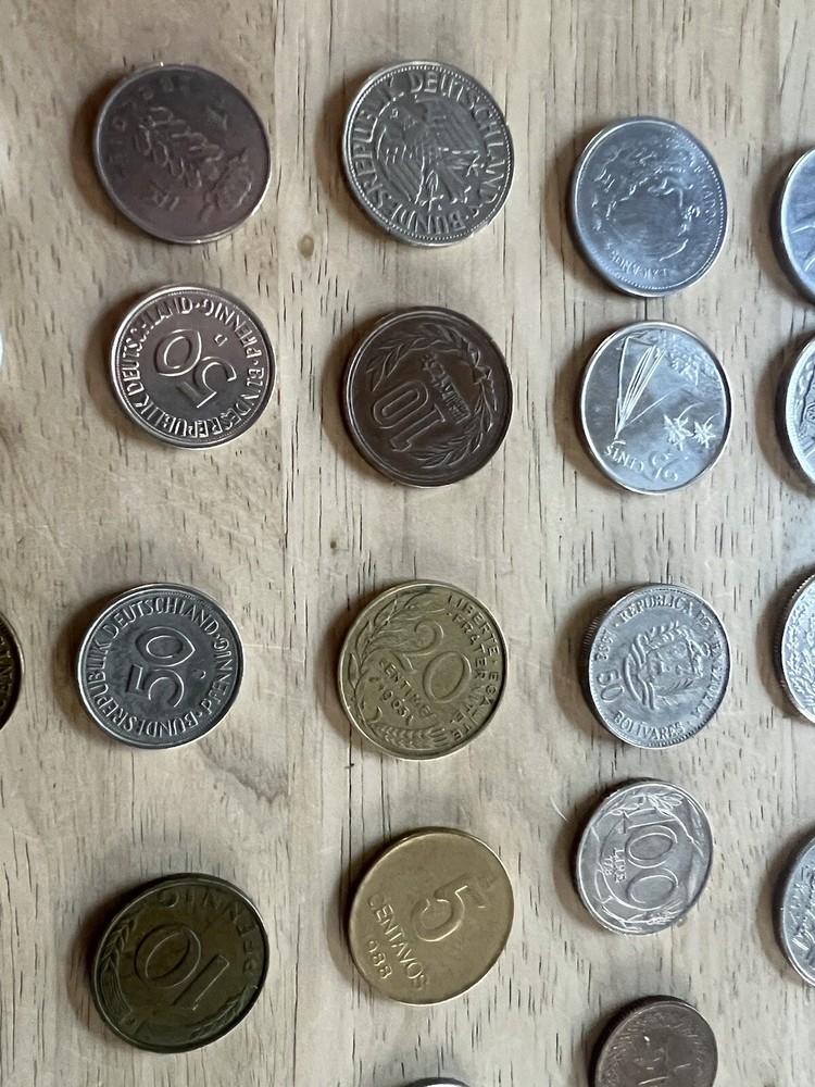 Assorted foreign coins. 26 Coins In Total