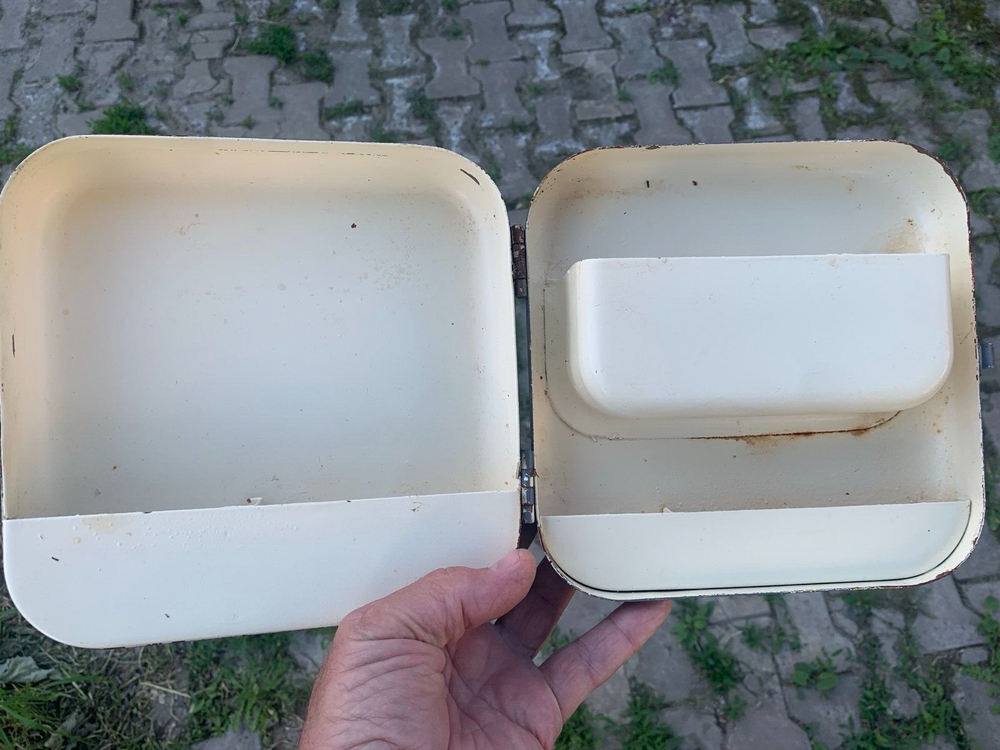 Old Soviet first aid kit with military equipment.