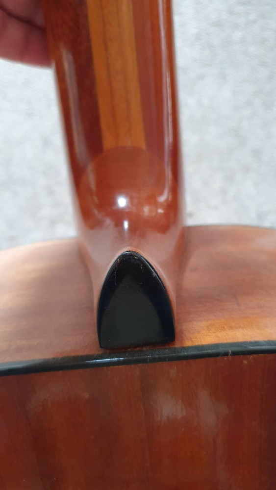 Old guitar with a nicely flamed back, needs service