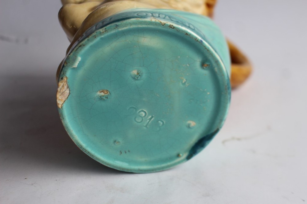 Sarreguemines slipware pitcher with double faces (39486)