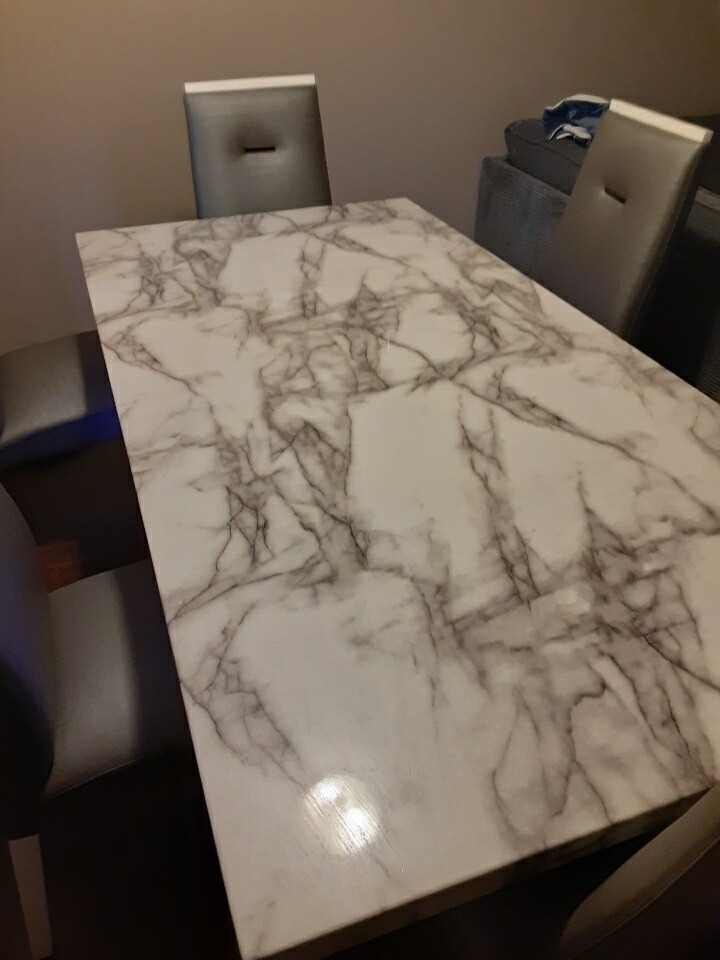 Marble Dining Table with 6 Gray Chairs and Beautiful Buffer with LED lights.