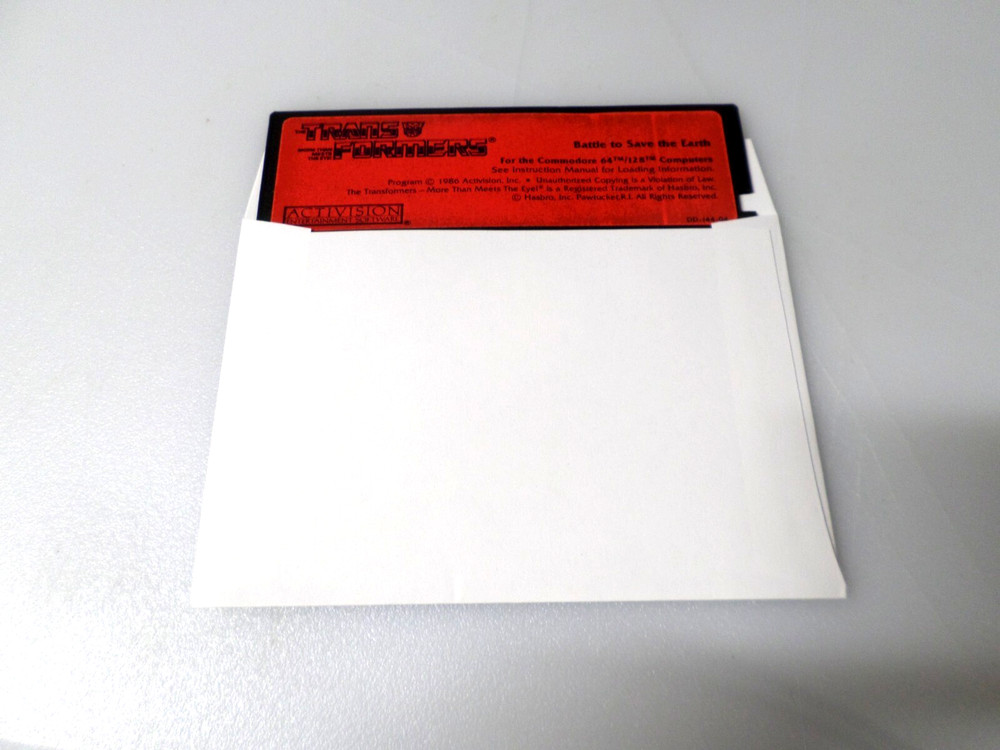 5.25" Floppy - COMMODORE 64/128 - TRANSFORMERS: BATTLE TO SAVE THE EARTH