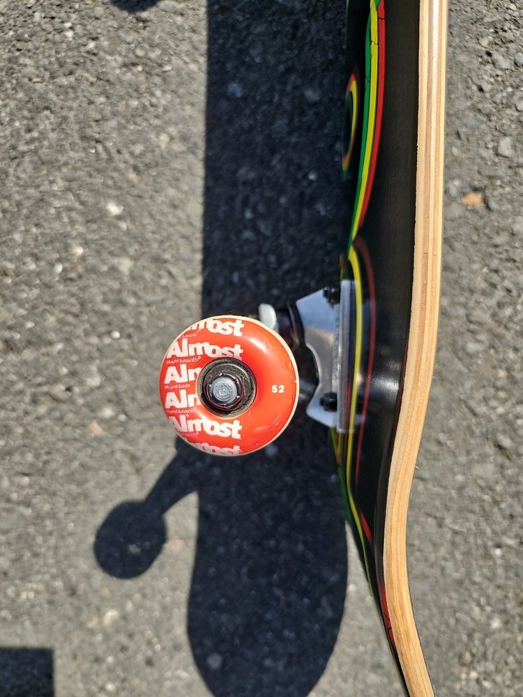 Almost Skateboards Complete Rasta Neon Logo Deck Tensor Trucks