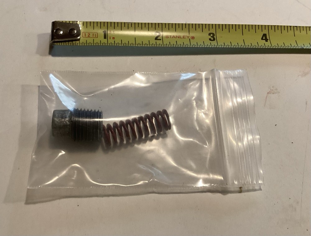 Troy Bilt Horse depth regulator spring and plug.