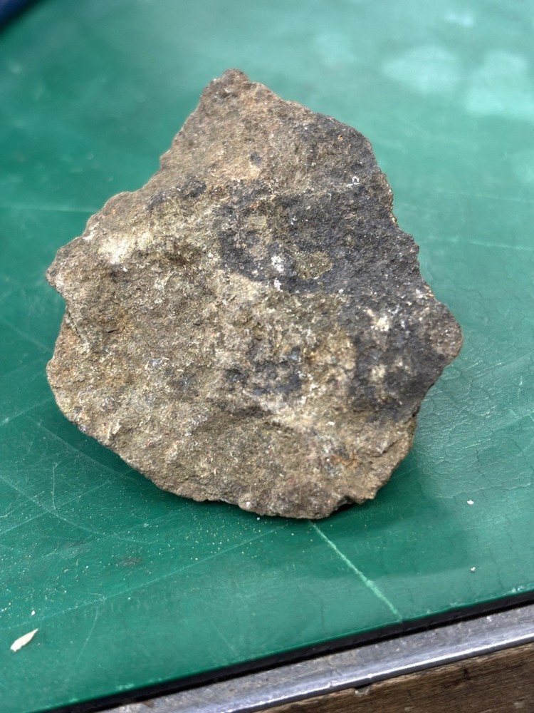 as gold ore on green stone