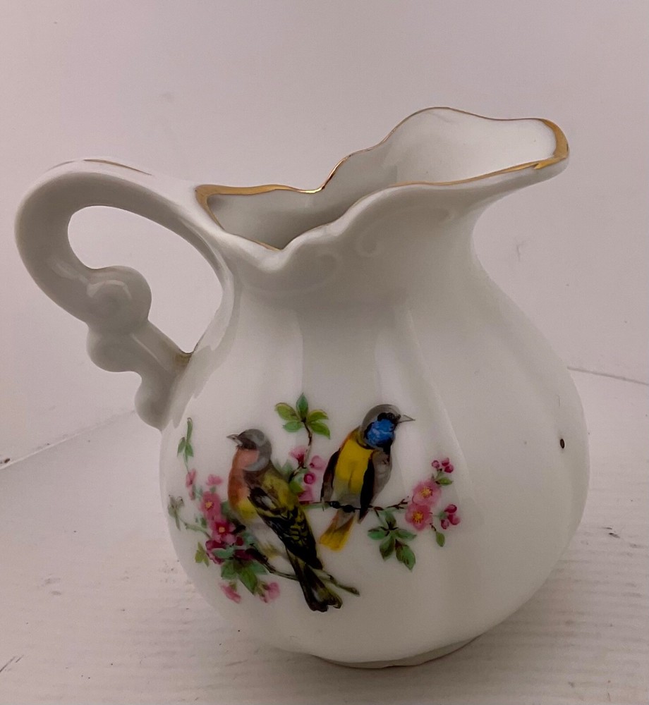 mini pitcher with birds, gold trim Royal Crown?