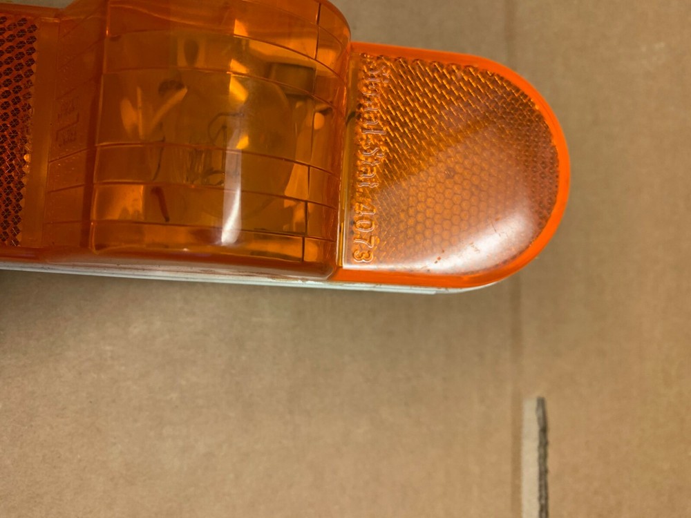 ONE GENUINE SIGNAL-STAT ORANGE STOP TURN TAIL LIGHT 4073
