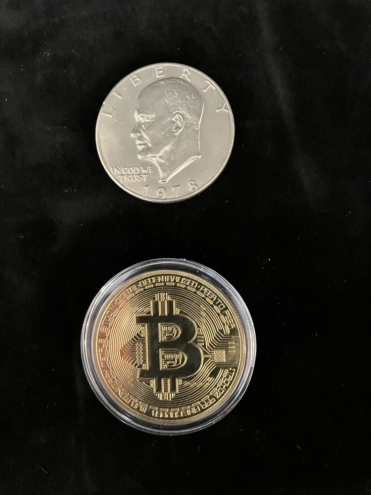 Bitcoin - gold colored Bitcoin in protective case.