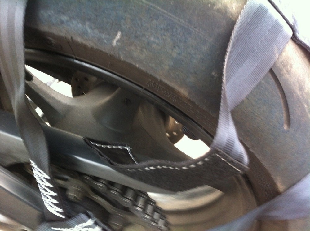 Rear wheel tie-down strap