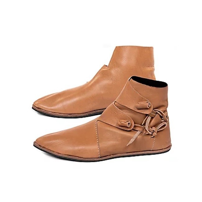 Medieval leather toggle up boot pair Two button up leather boot footwear