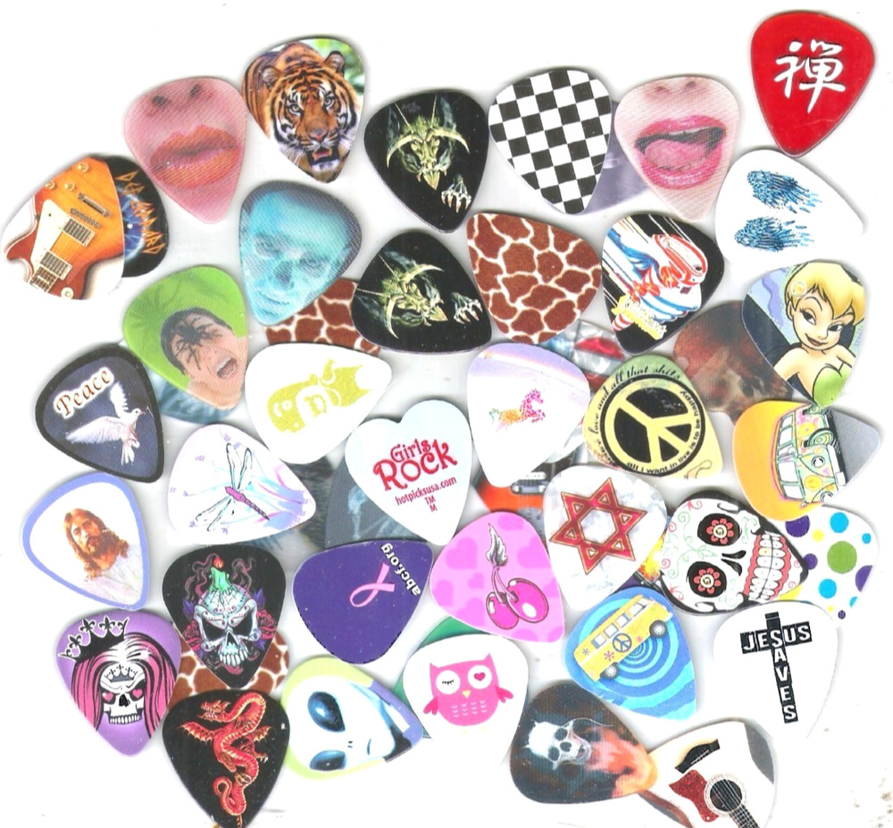 6 DIFFERENT  GUITAR PICKS  BASE MUSIC STRINGS BANDS..99 CENTS....