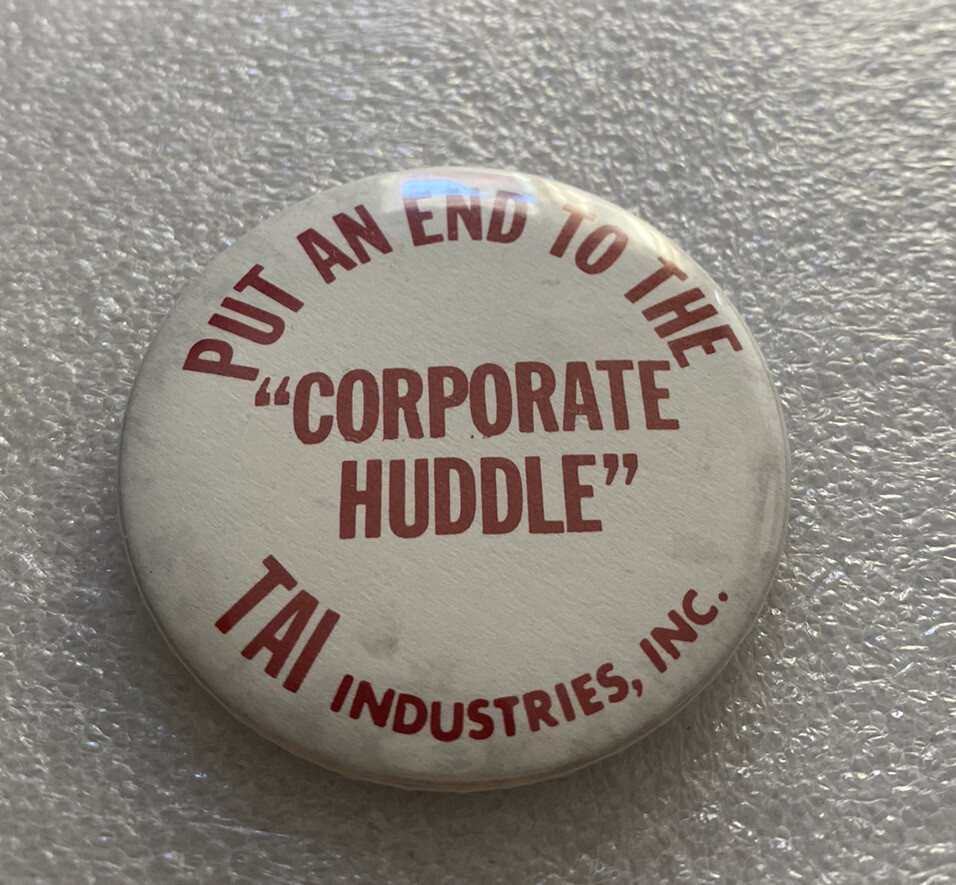 PUT END TO THE CORPORATE HUDDLE Pin Button TAI Industries FL Communication Tech.