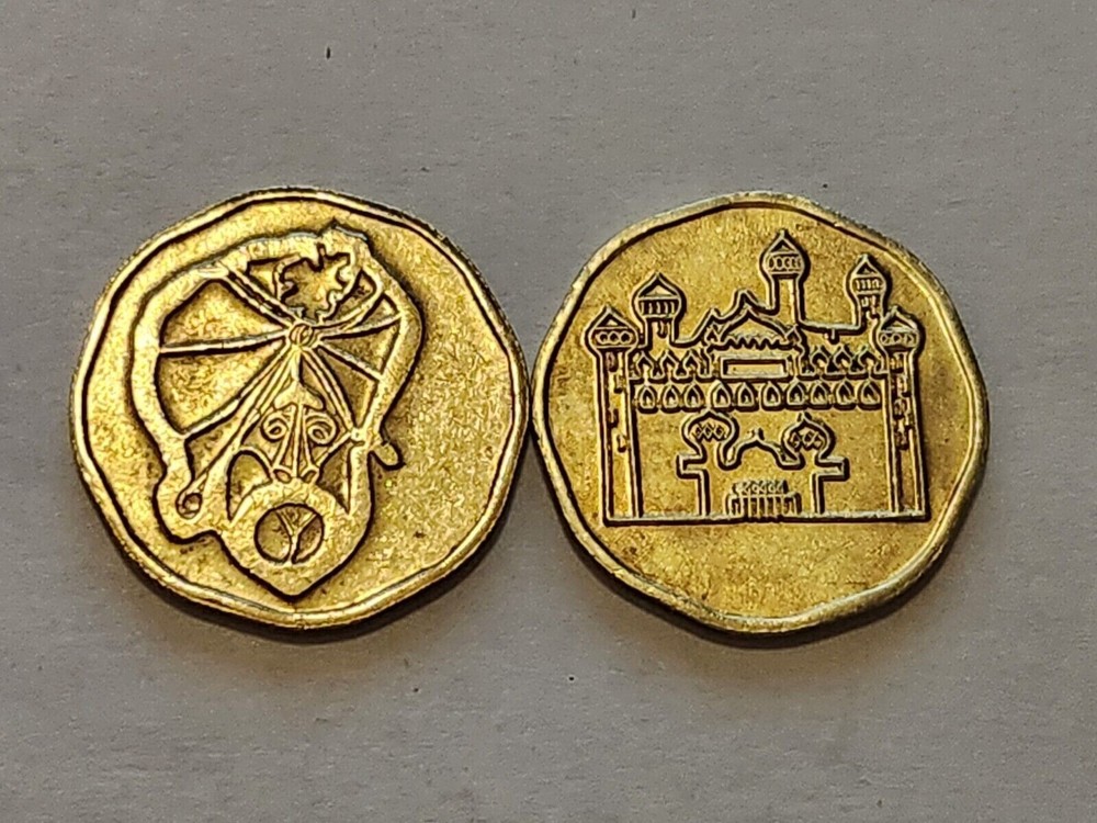 ALADDIN'S CASTLE - 8 SIDED ARCADE TOKEN - GENIE/CASTLE