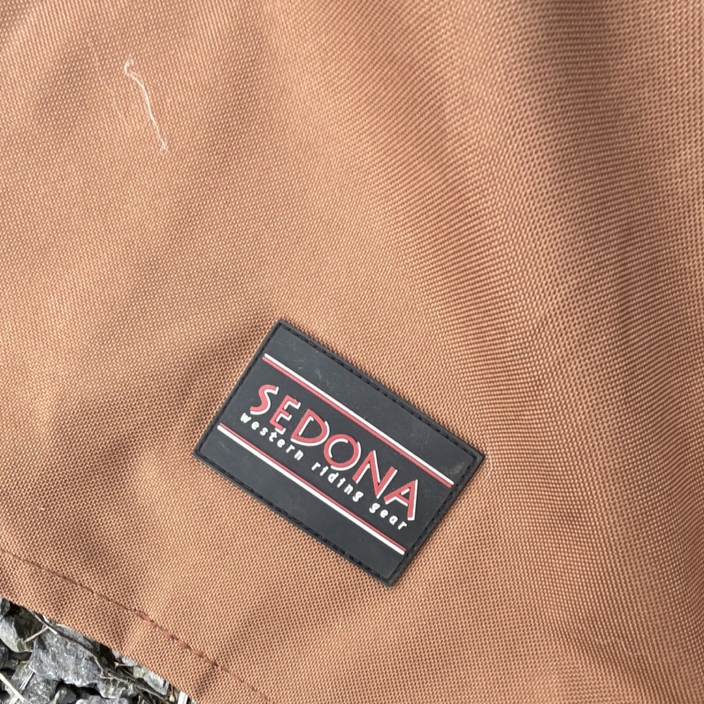 3 saddle covers. One new 2 used