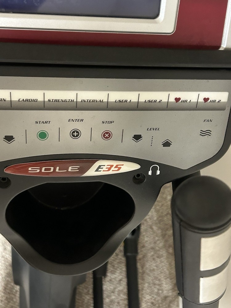 Sole E35 elliptical machine, featuring its digital display panel, dual handlebar