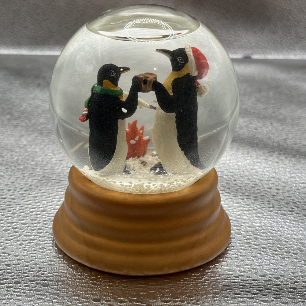 Eddie Bauer Penguin Snow globe 2002 Open Fire Roasting Marshmallows