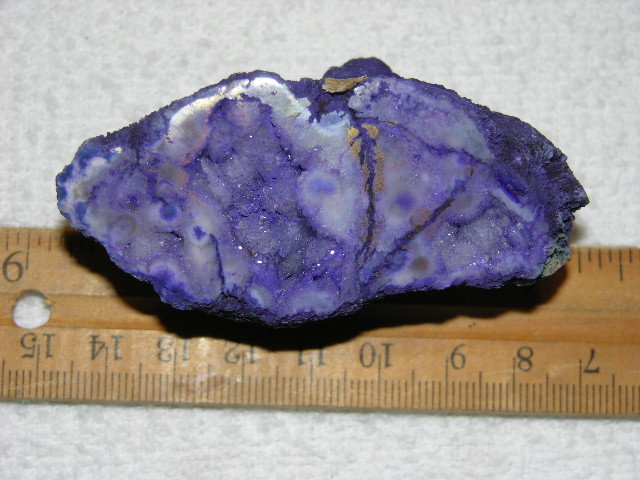 Geode cut & polished half with colored crystal center 3 inch E29