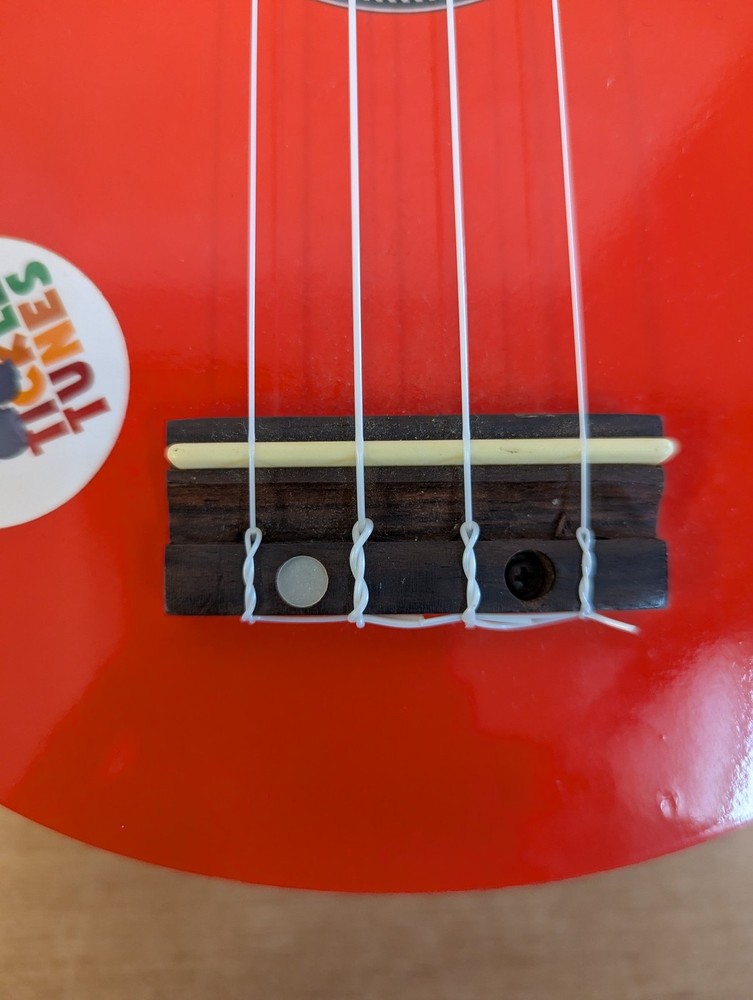 Octopus Soprano Ukulele Red with 4 Strings Includes Case for Beginners