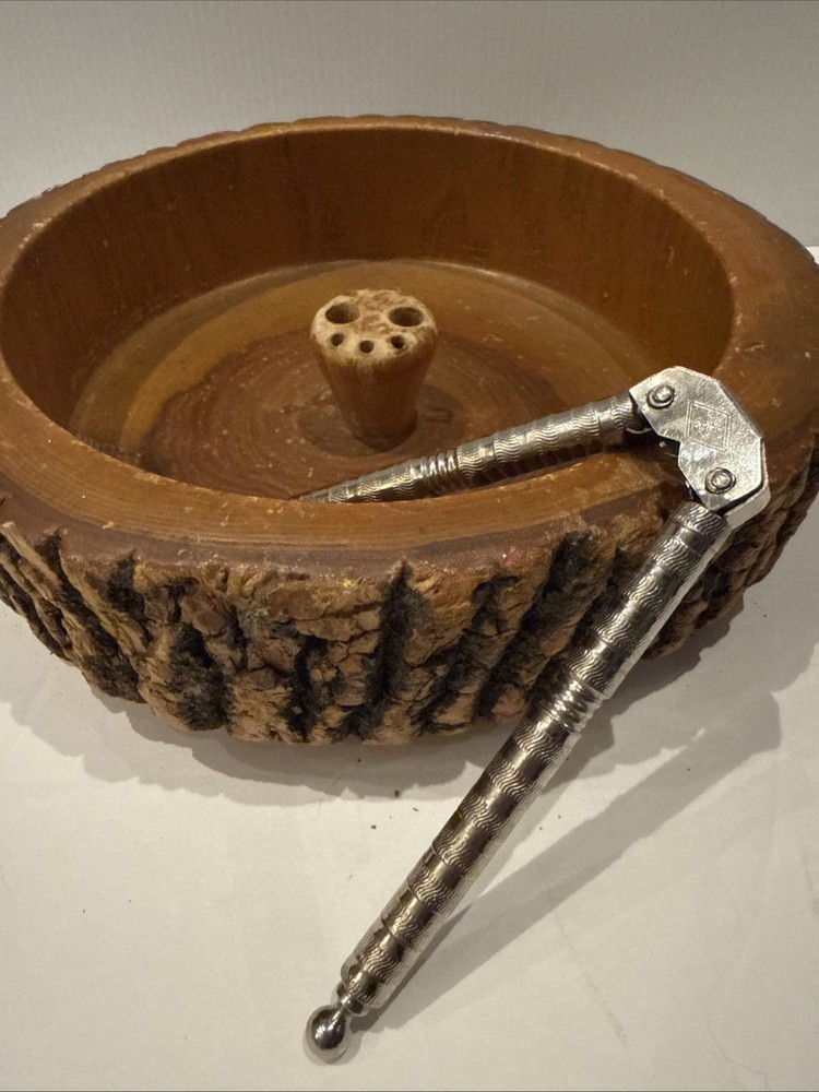 Vintage wooden nut bowl with rustic tree bark,