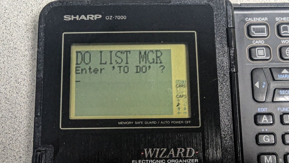 Sharp Wizard OZ-7000 Electronic Organizer with Time & Expense Manager Card