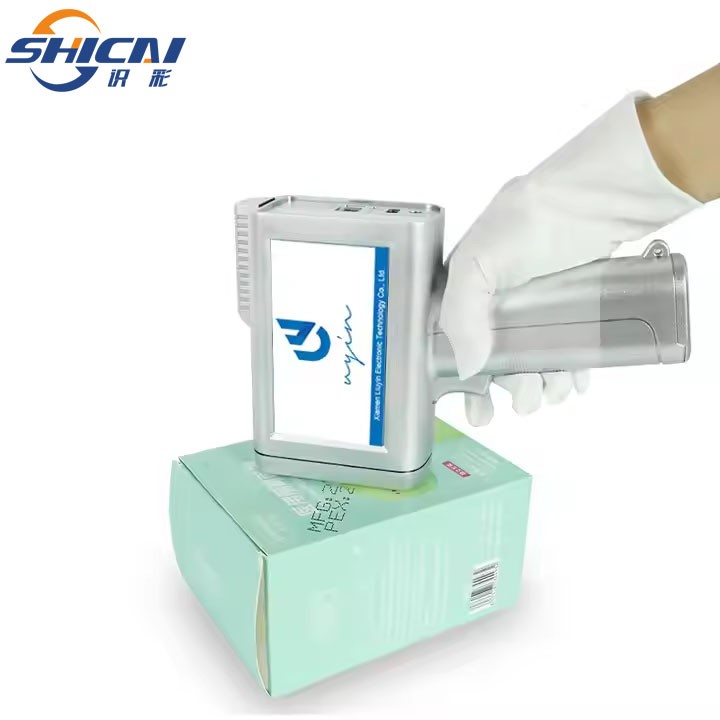 Handheld inkjet printer prints date, logo text, variable data on cardboard box