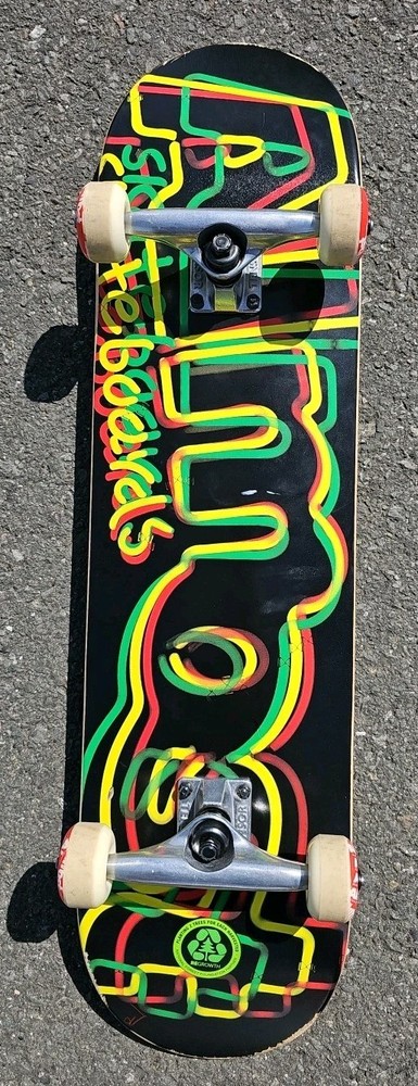 Almost Skateboards Complete Rasta Neon Logo Deck Tensor Trucks