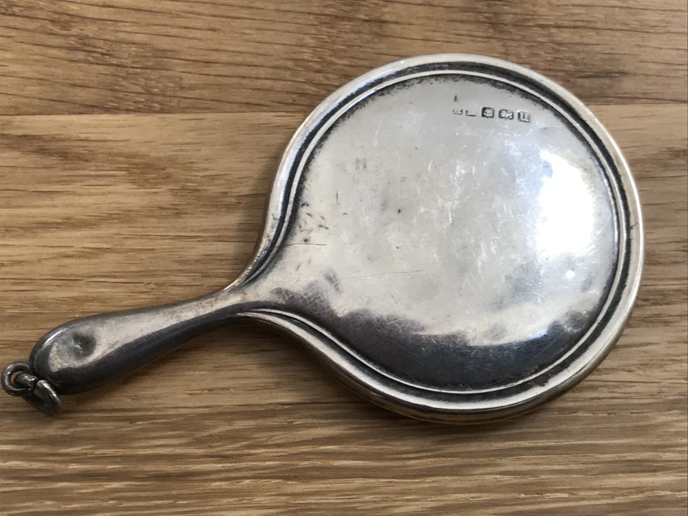 nice looking small size solid silver vanity mirror