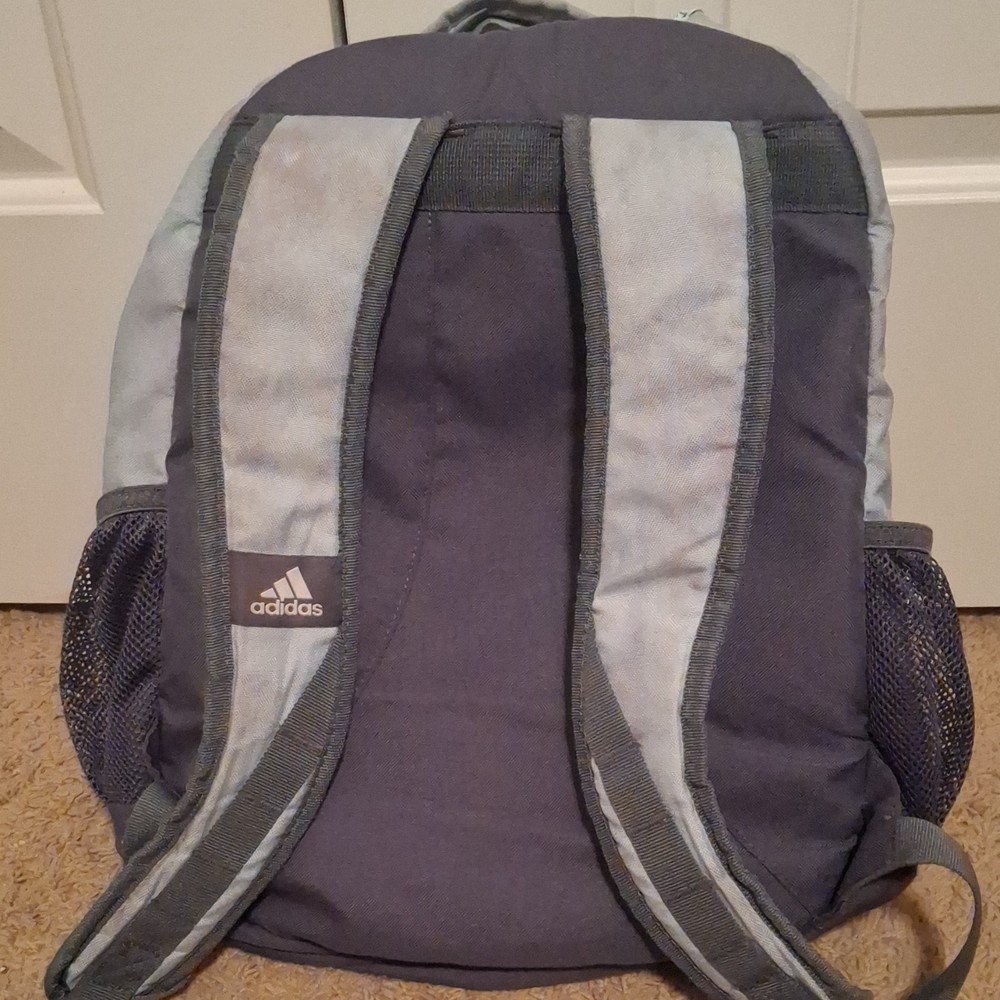 Adidas light blue with pink splash design Backpack 5 Pockets.