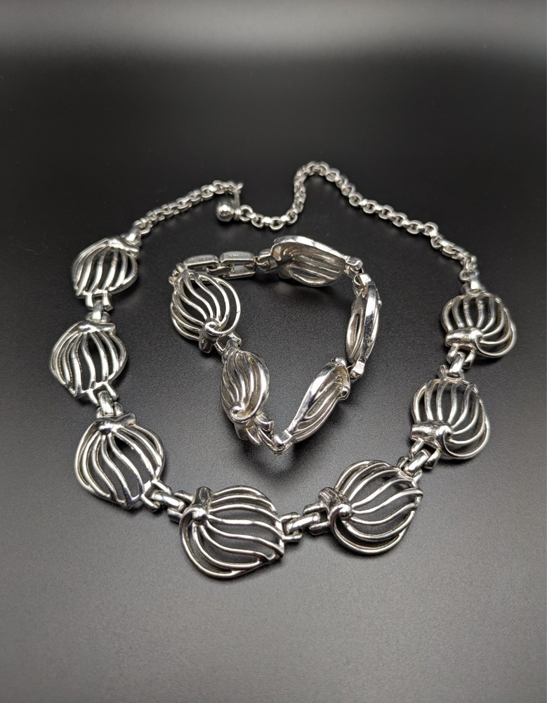 Silver-Toned Bracelet and Necklace Set Featuring Abstract Leaf Patterns