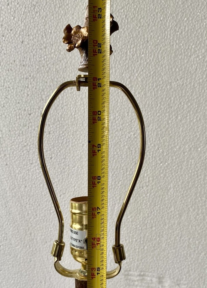 Antique floral and bird table lamp featuring a rustic tree-branch stem