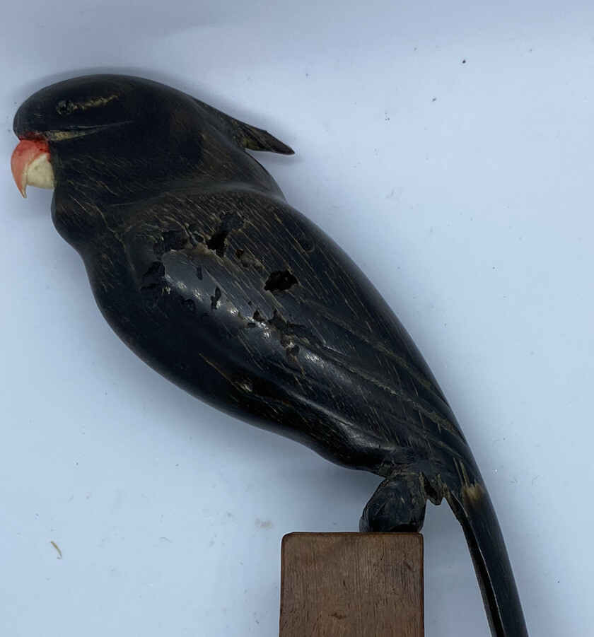 carved parrot on perch