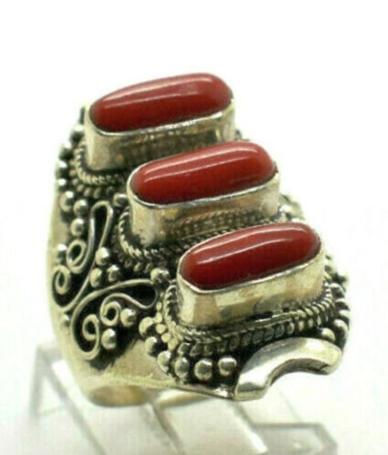 This is Sterling Silver Ring with Coral .  adjustable fit