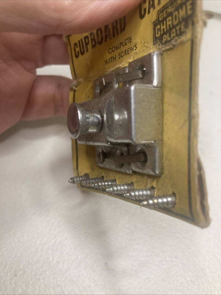 NOS- vintage chrome-plated cupboard catch.