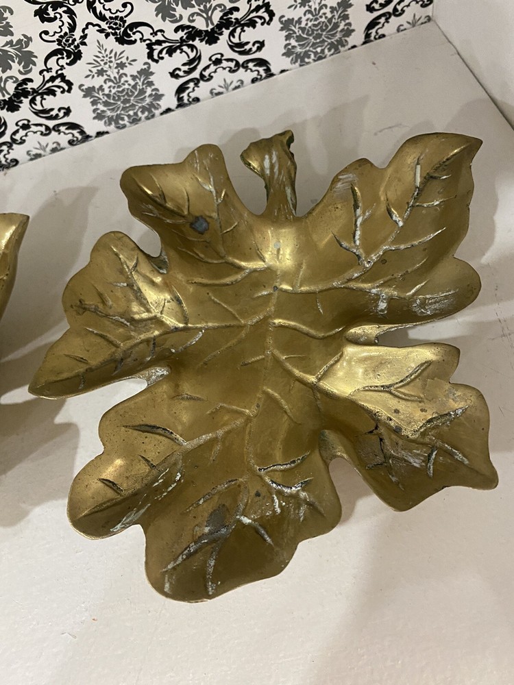 two beautiful solid brass leaf design wall decor. 7 inches tall.