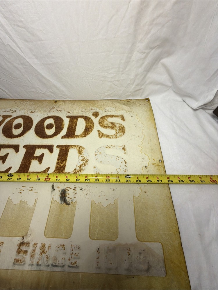Woods Seeds Embossed Tin Sign