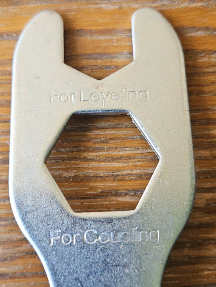 LEVELING, COUPLING, SHIPPING METAL MULTI TOOL.